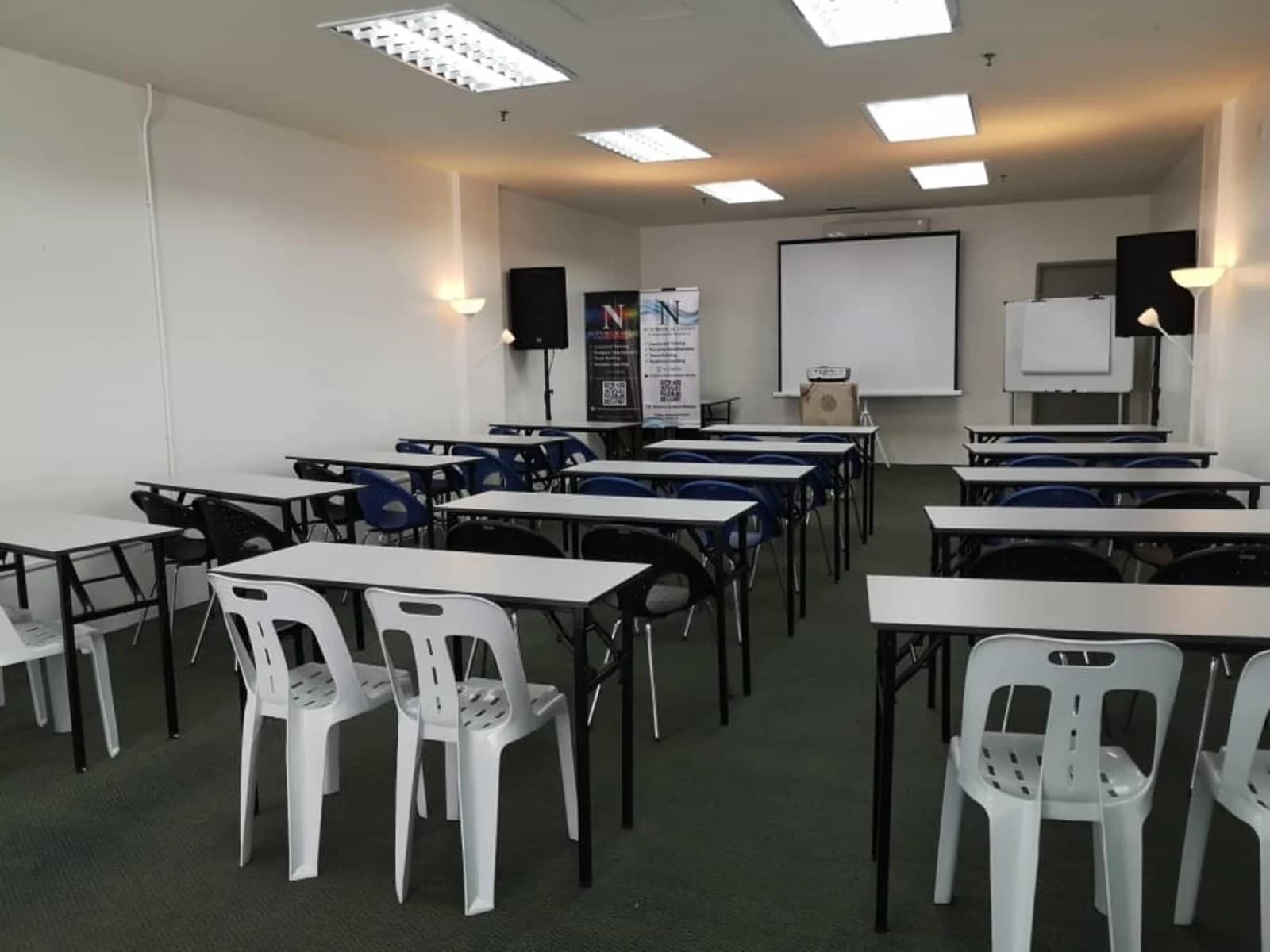 penang event space with classroom seating and projector screen