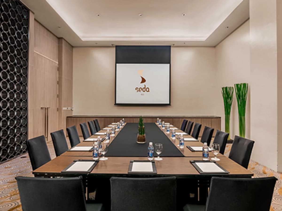 hotel conference room with projector screen; memo on table hotel taguig