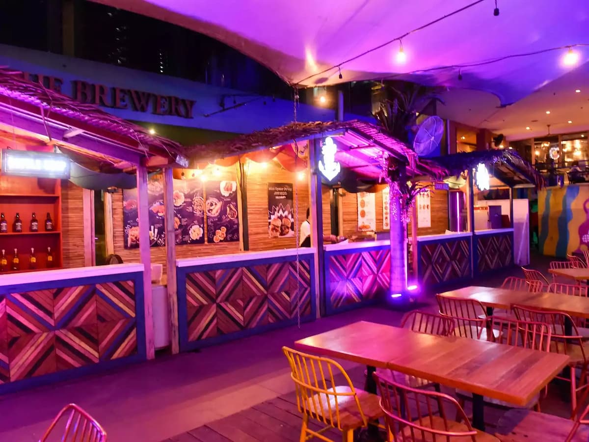 manila year end party space with several food and drink booths