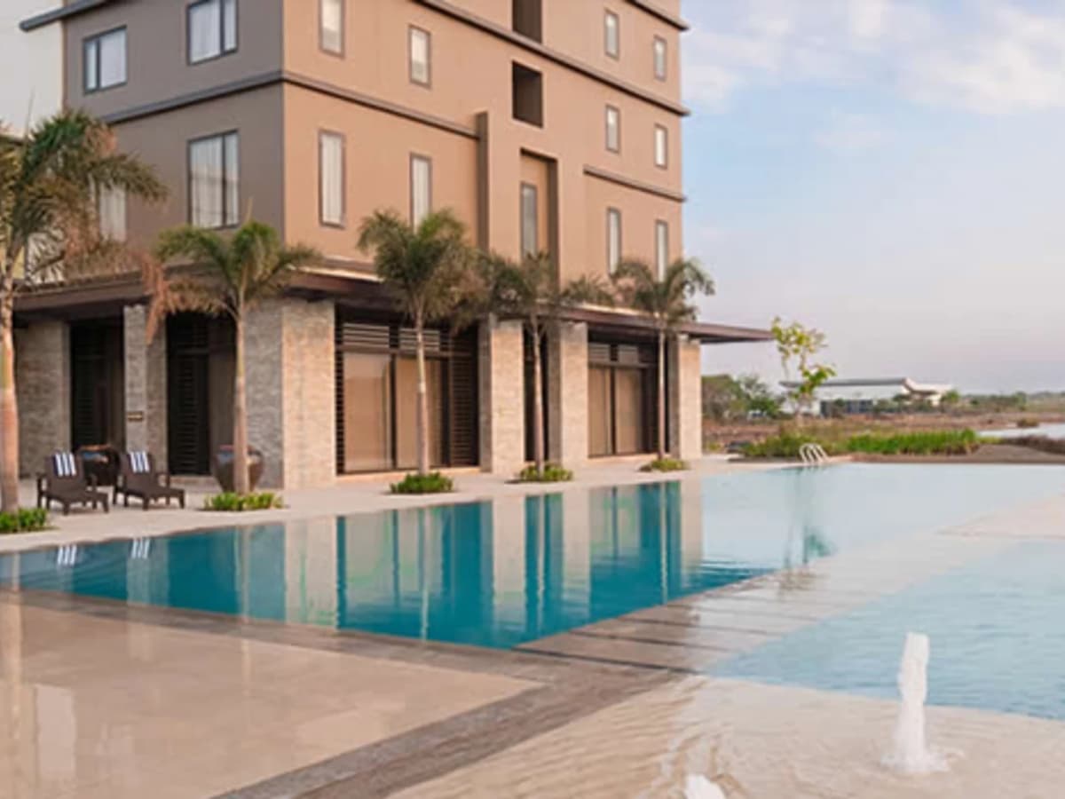 swimming pool next to hotel building laguna