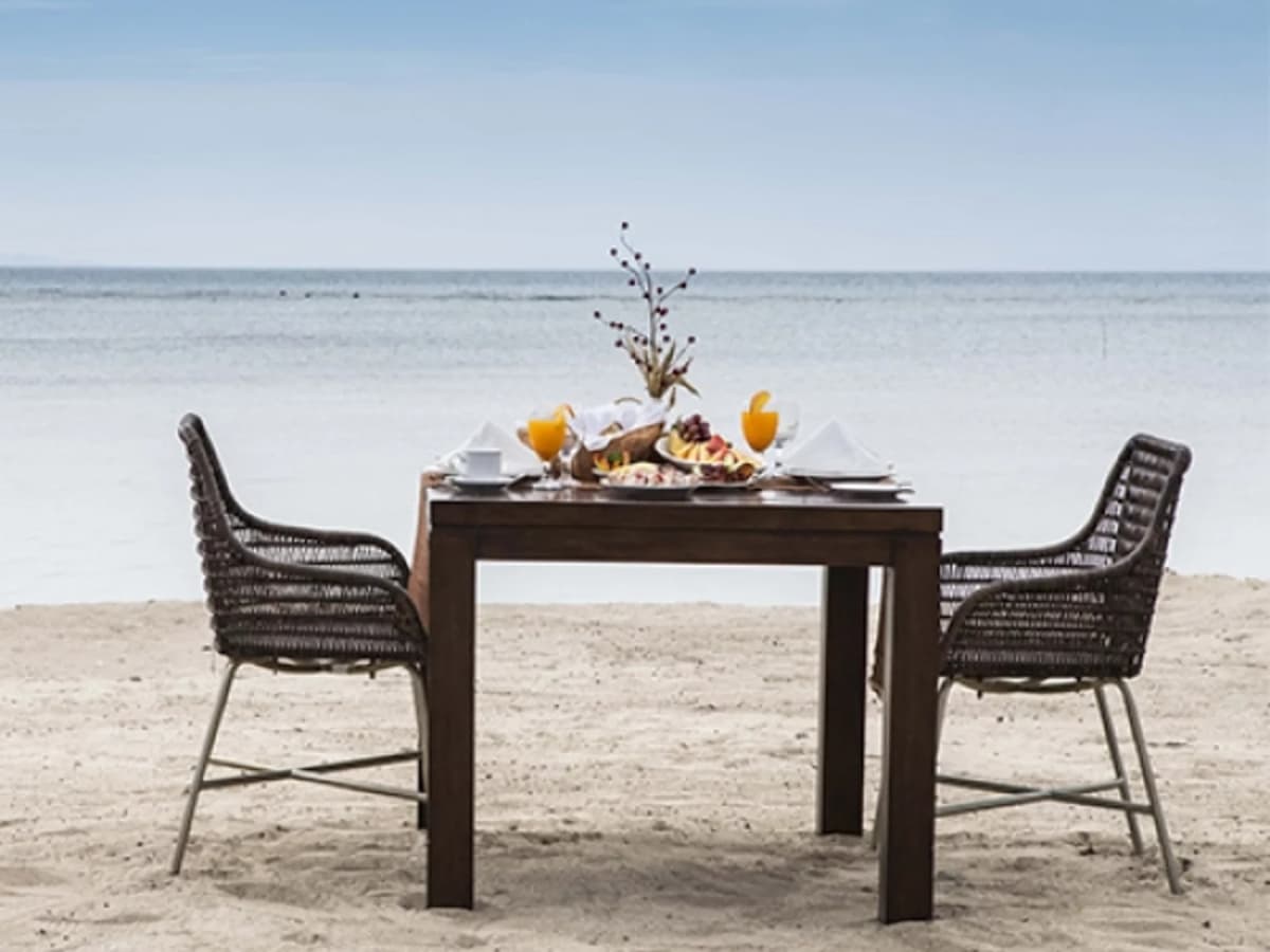 table setup at the beach for couple who celebrate anniversary event hotel batangas