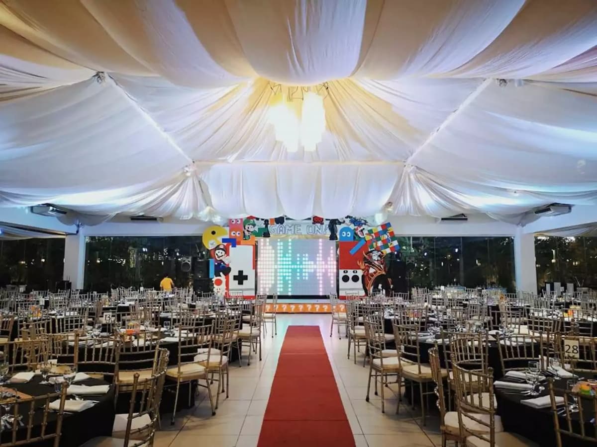 red carpet wedding aisle between guest tables event place antipolo