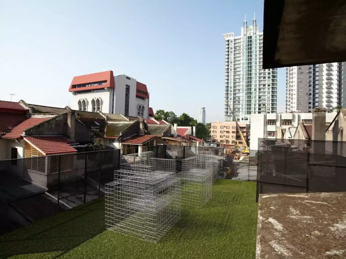 rooftop party space in kuala lumpur with city view and artificial grass