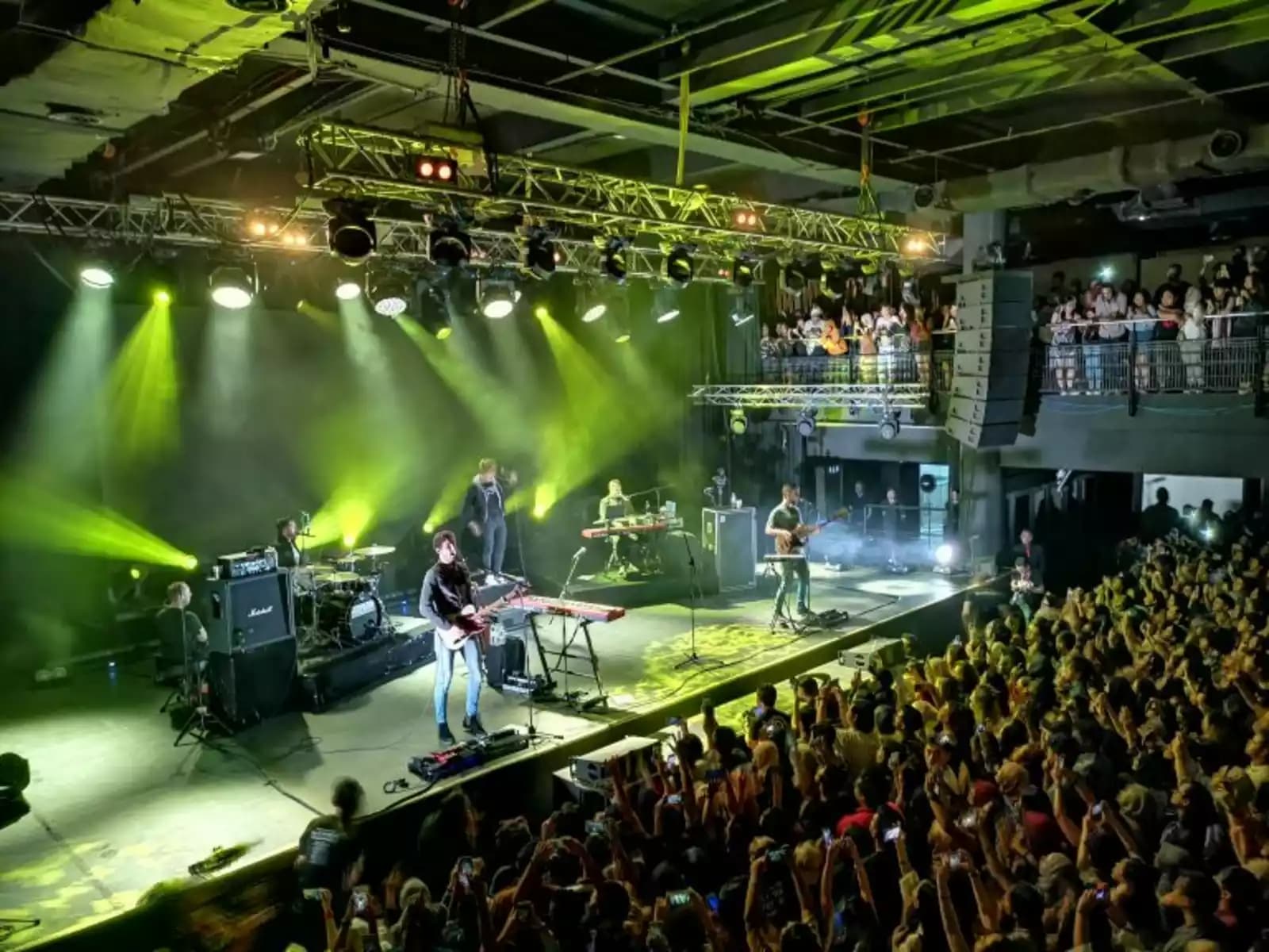audience enjoying band concert in 2000 capacity venue