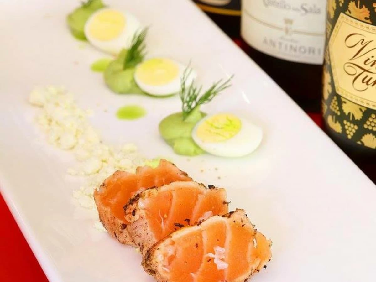 salmon appetizer served on the plate with garnish