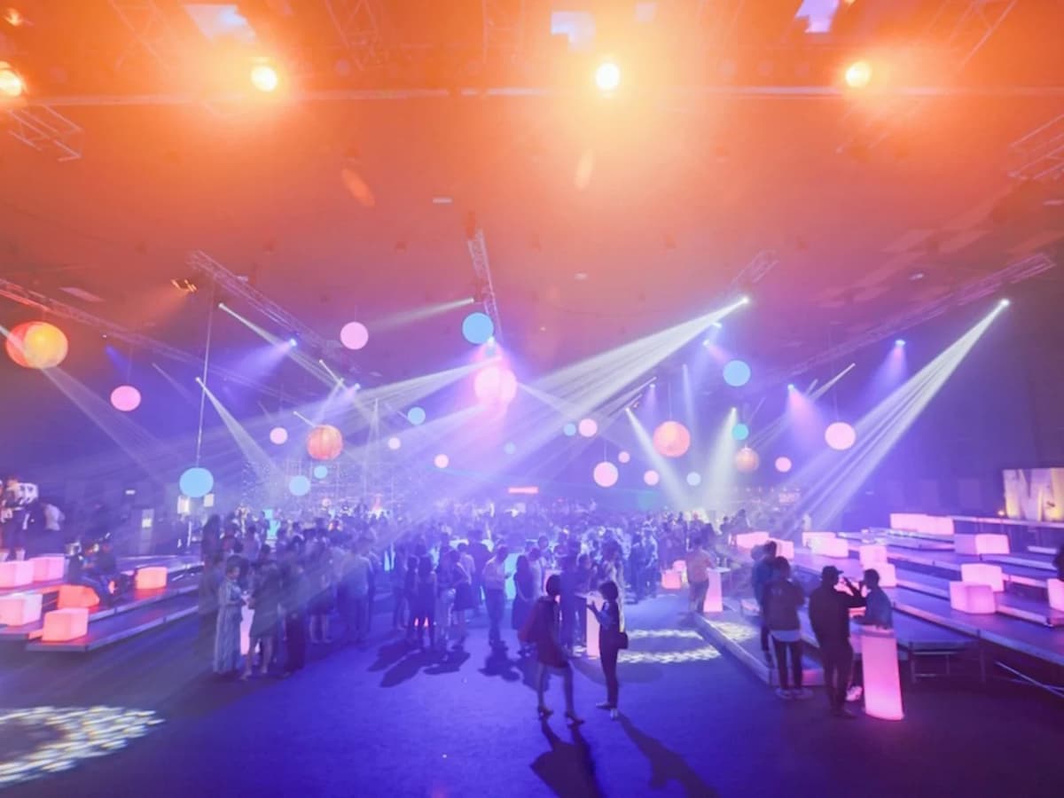 a lot of people join the concert with colourful lighting