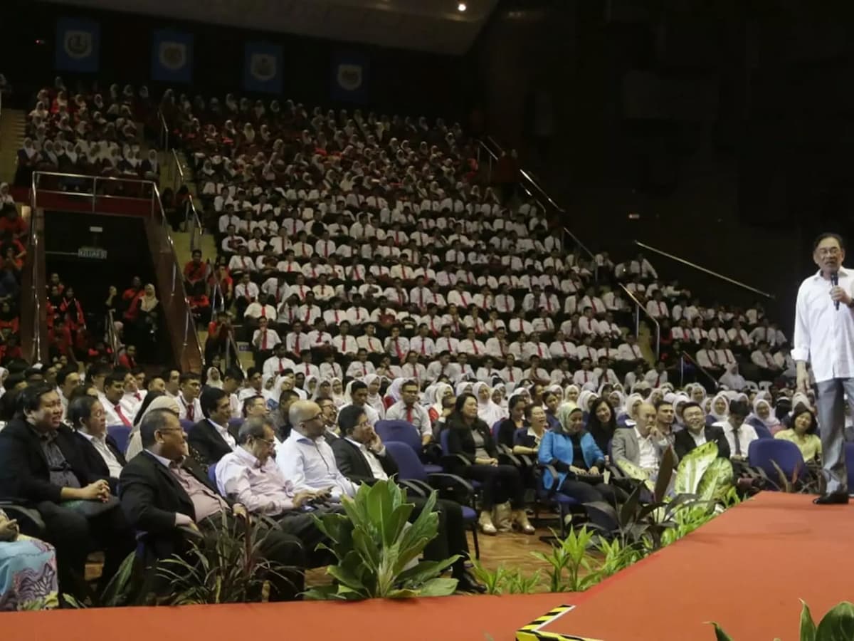 government's event with speaker on the stage of the auditorium