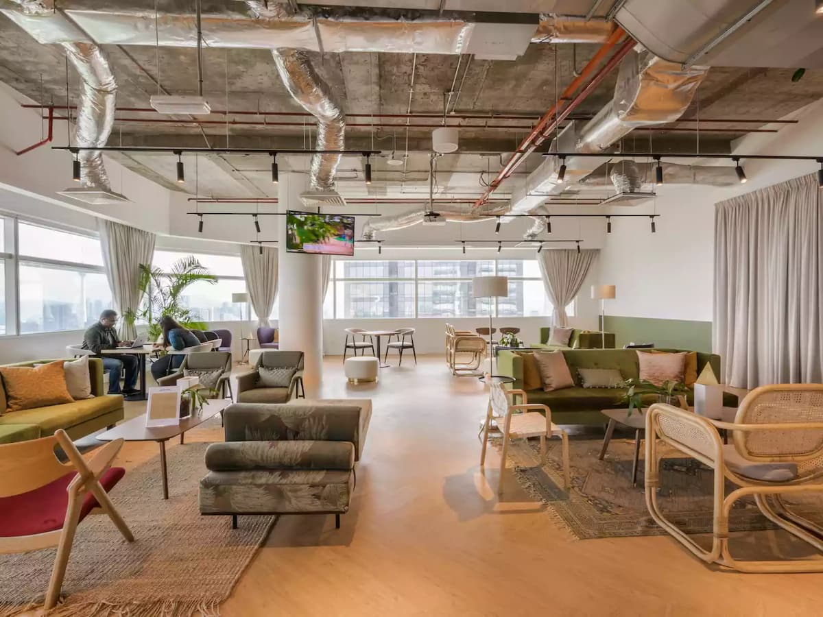 coworking lounge area with lot of sofas