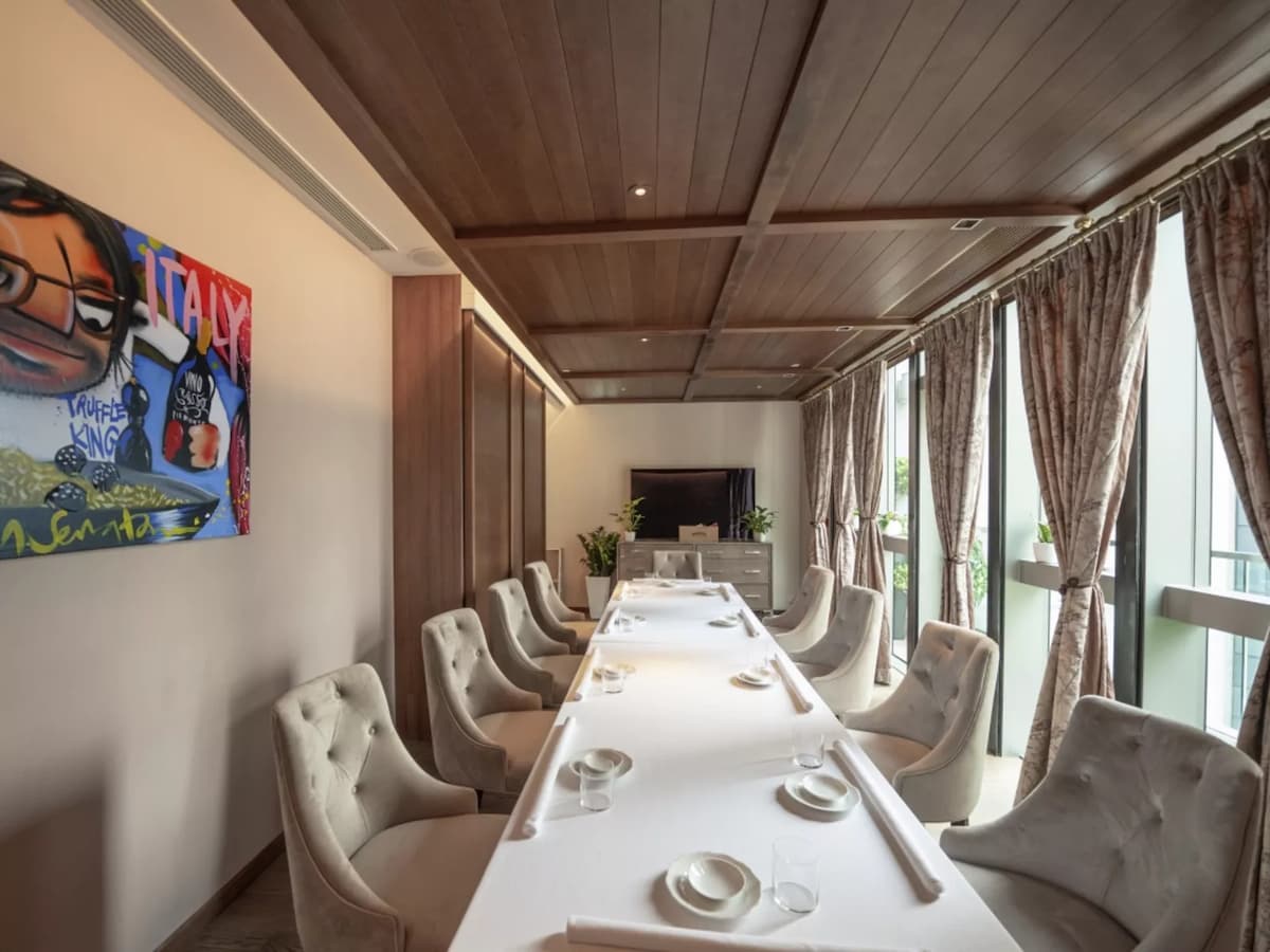 private room with long table setup for intimate event