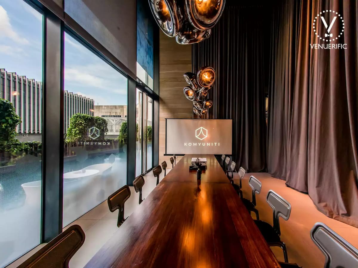 offsite meeting room with long wood table and pool view