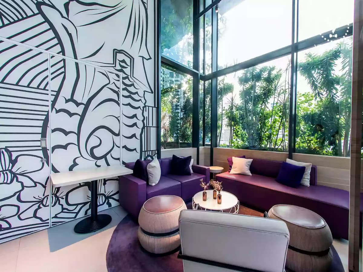 media event venue with merlion park mural graffiti and cosy purple couch with natural light