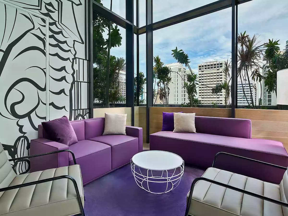 media event venue with merlion park mural graffiti and cosy purple couch with natural light