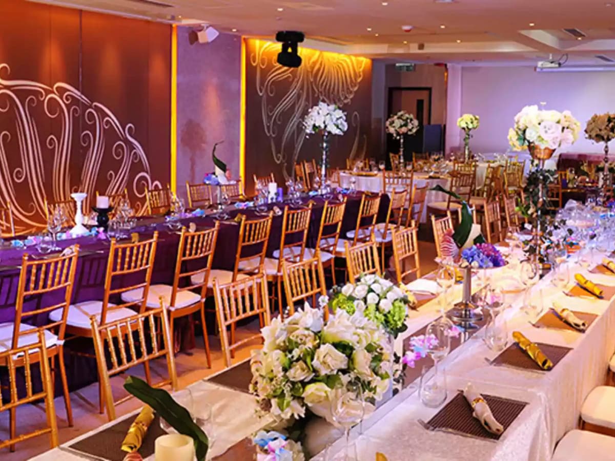private wedding celebration using long table setup and white flower decoration on the table