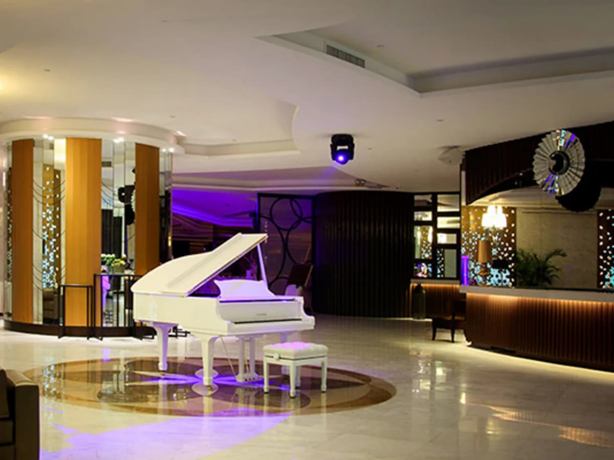 lobby area featuring the grand white piano