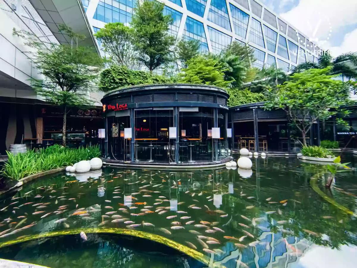 singapore restaurant with outdoor area and large fish pool