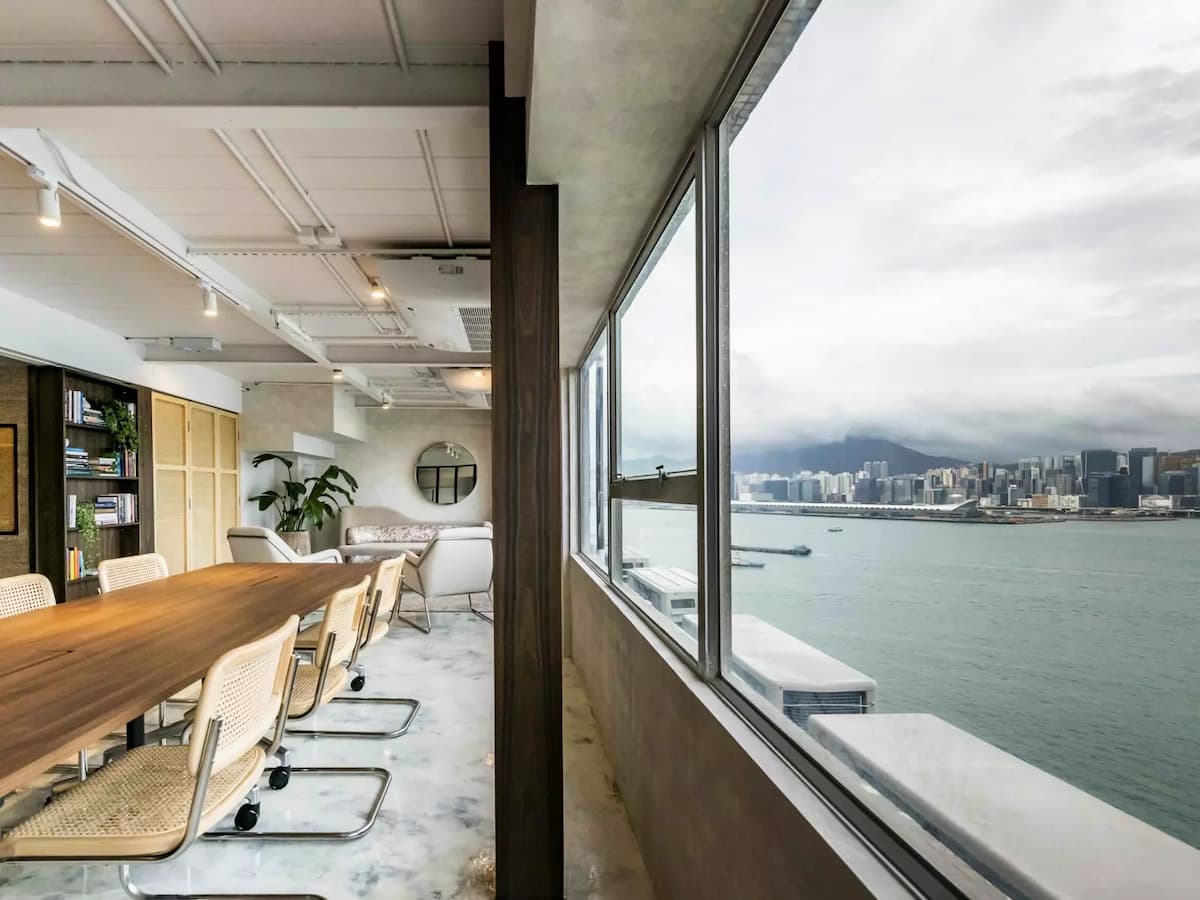 modern rustic spacious conference room with long table and sea view for meeting venues for rent