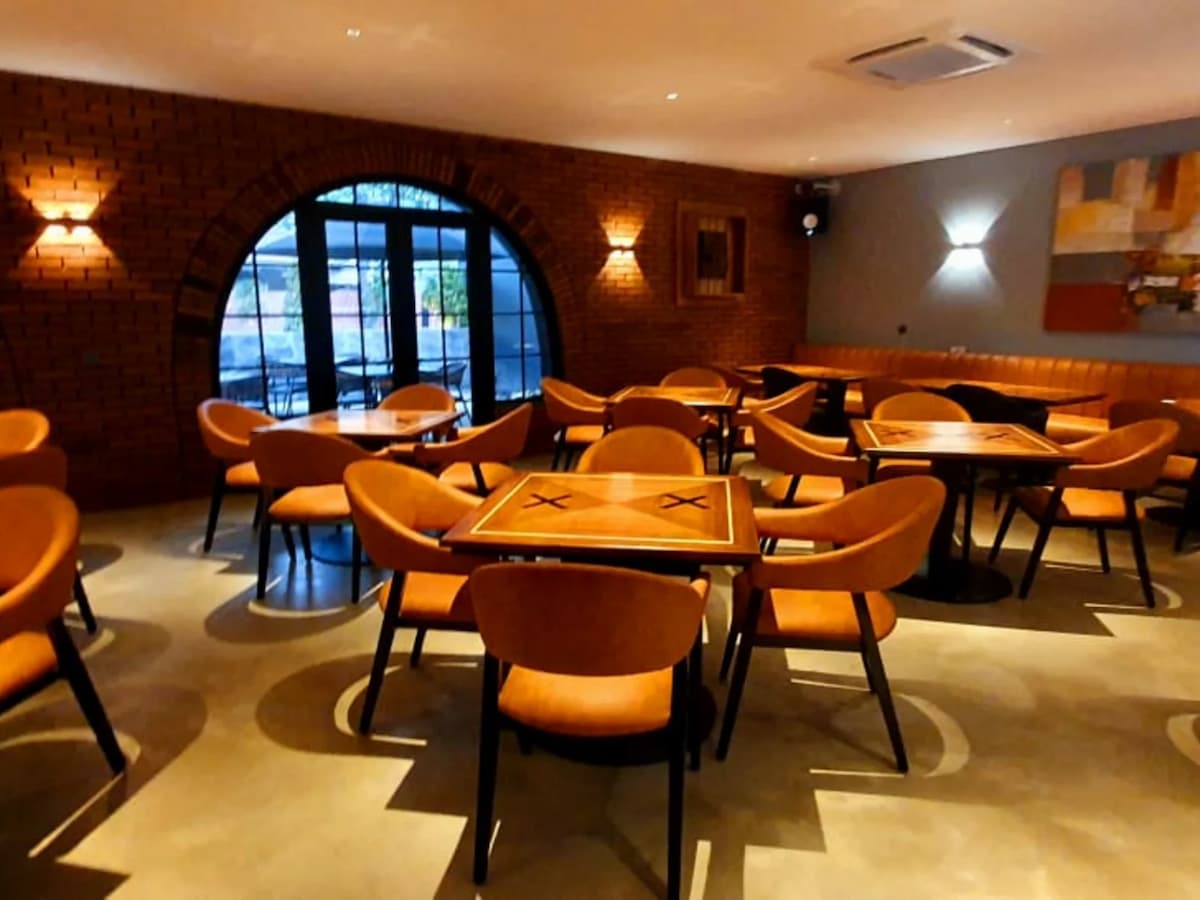 Four chairs around square tables