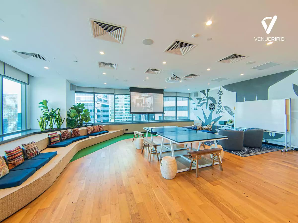 team building venues singapore with wood floor and different seating layout