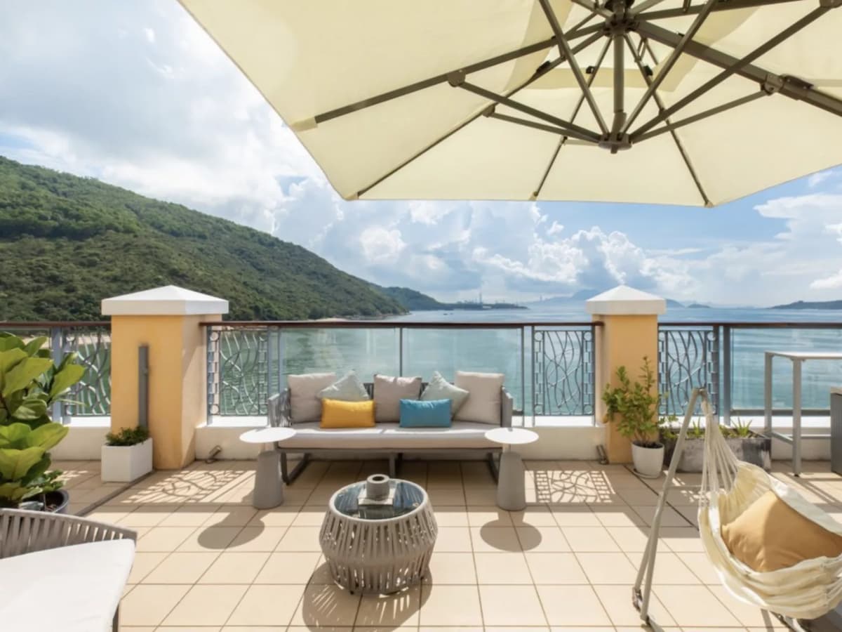 Balcony with sofas overlooking ocean