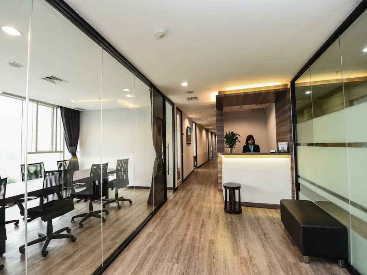 office spaces and meeting venues for rent with front information desk and seating area in indonesia