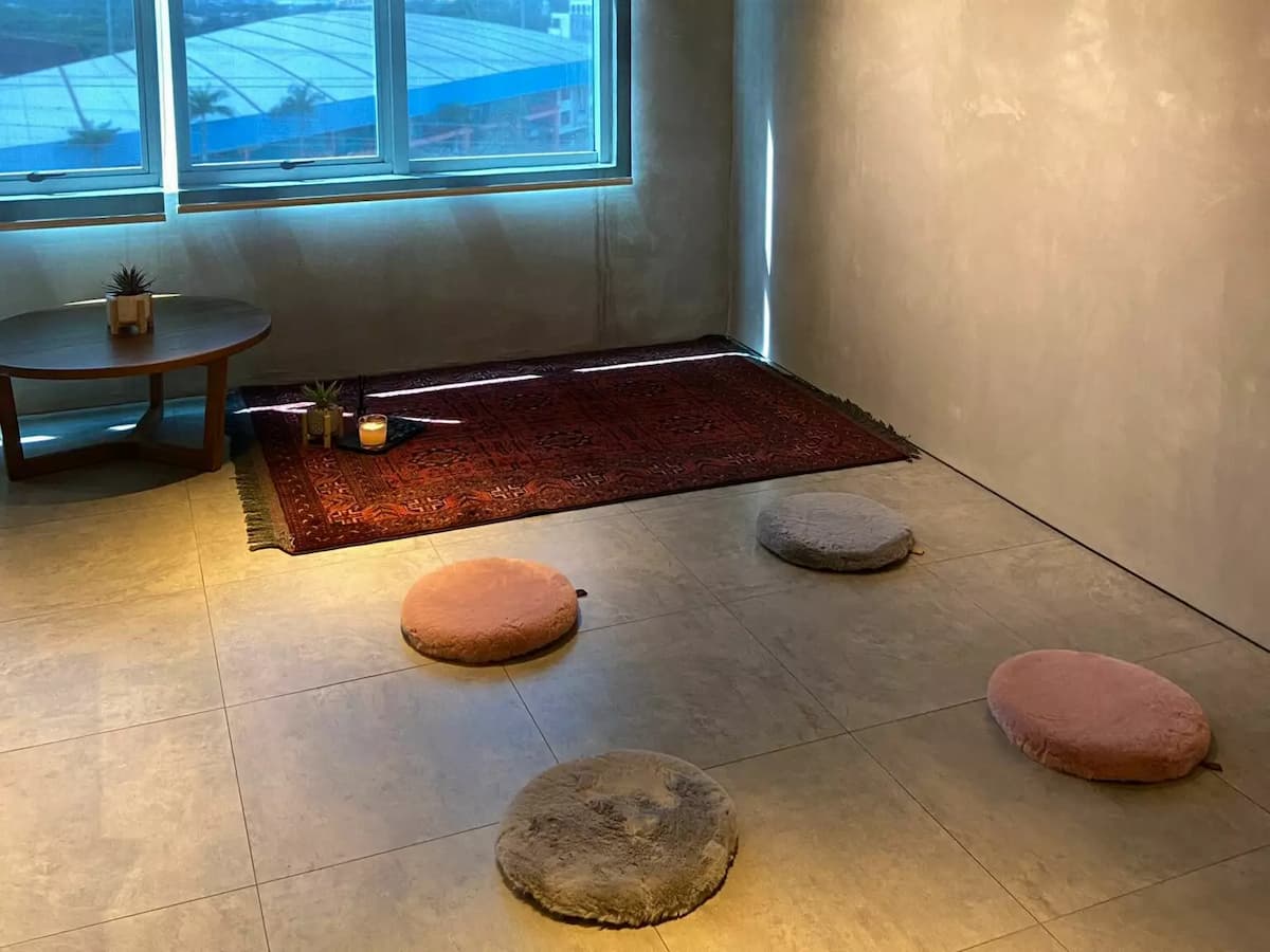 networking event venue with red persian rug and floor chairs