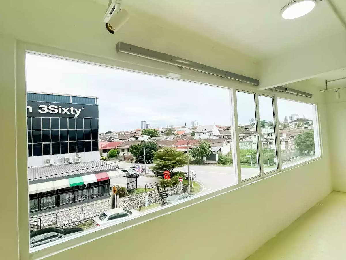 product launch event space with white interiors and large windows overlooking neighbourhood