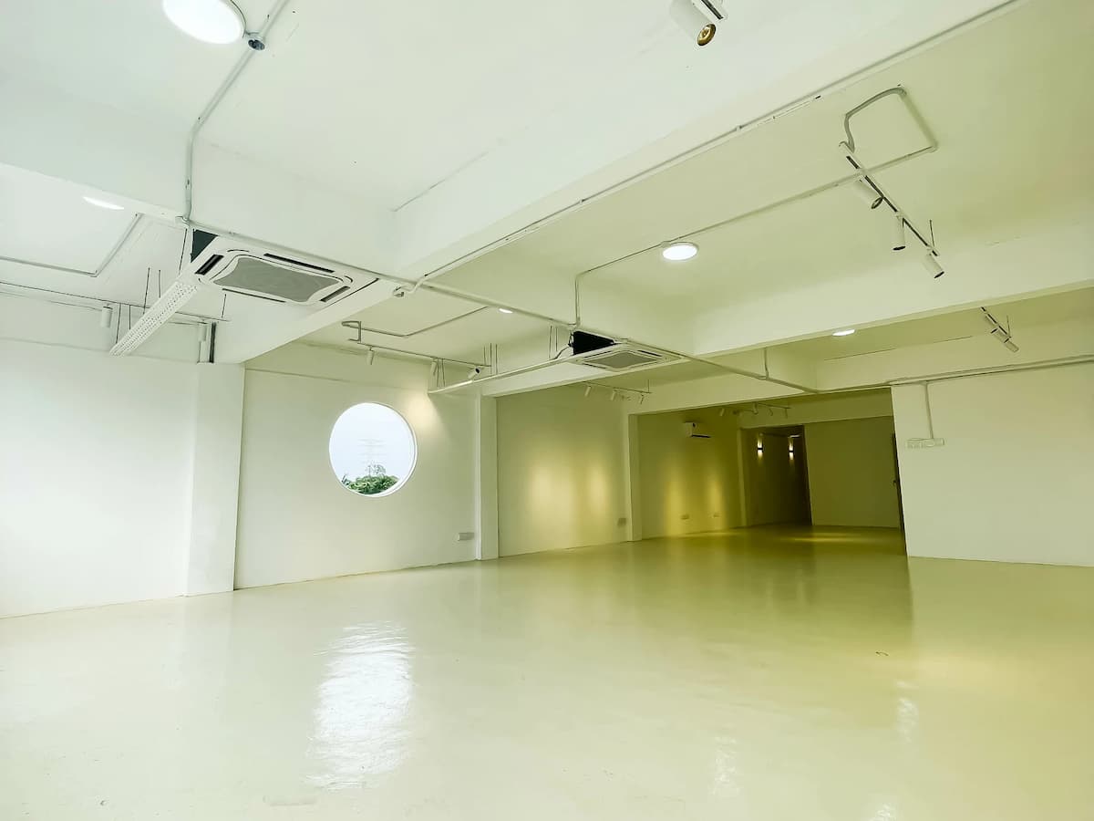 spacious media launch event space with white interiors and empty space