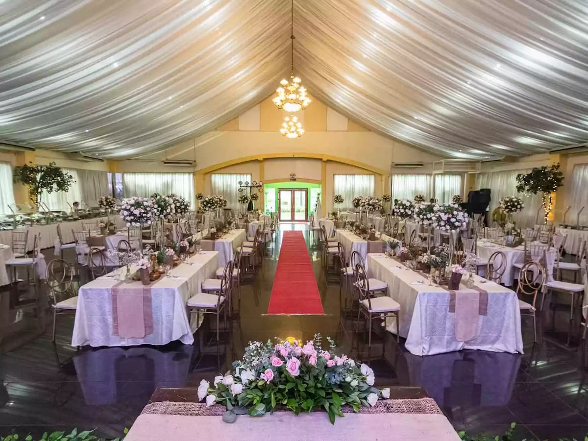 wedding event venues in the philippines with large reception hall with long dining tables pasay