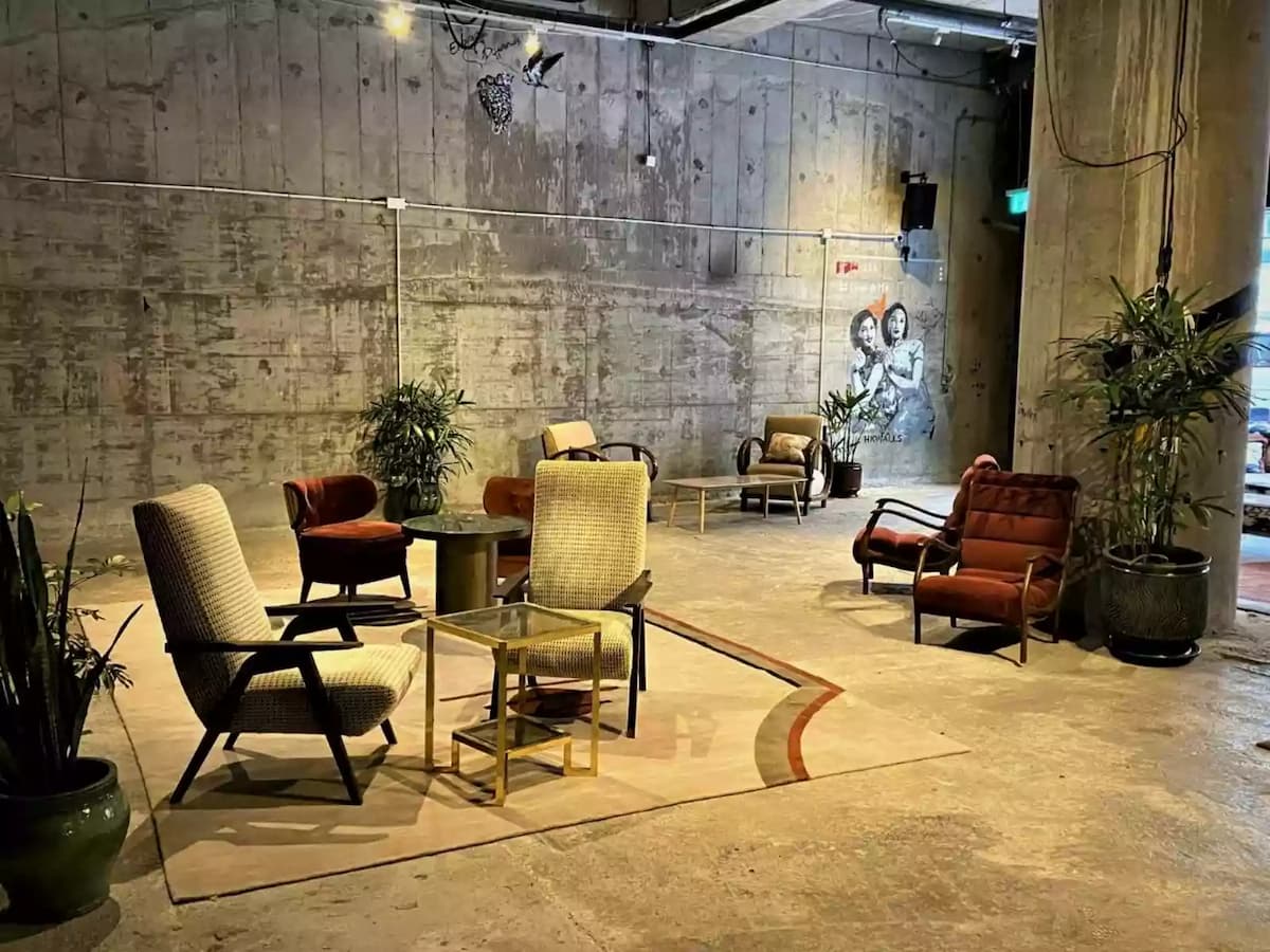 networking event venue for rent in hong kong with modern artsy furniture and cement walls