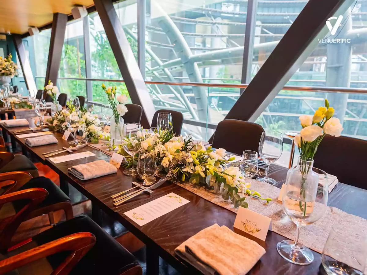 wedding reception event space Singapore table set-ups with white flowers and exquisite glasses