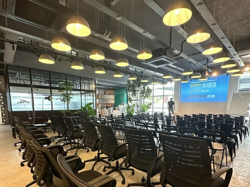 seminar space with individual office chairs and a projector