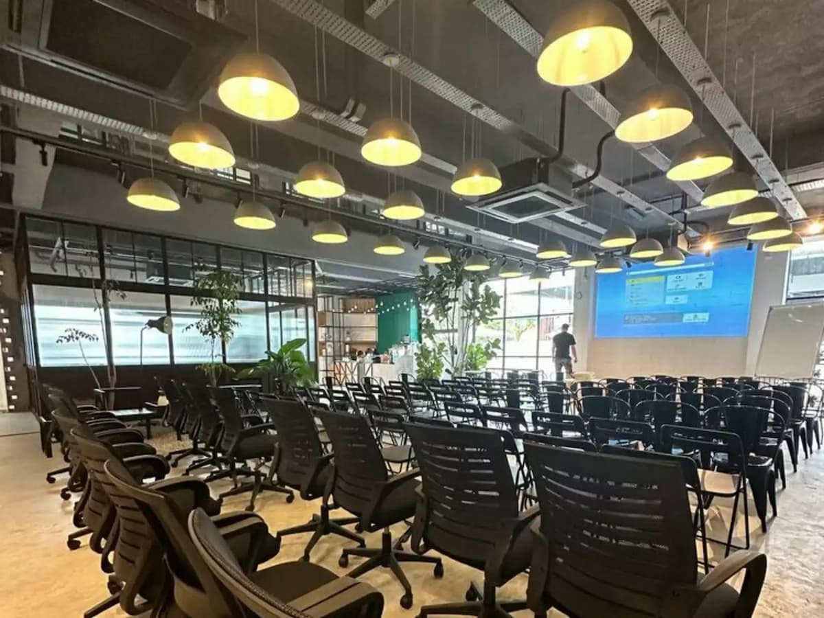 rows of chairs facing a projector screen set up for a corporate seminar at an event venue in bandar sunway