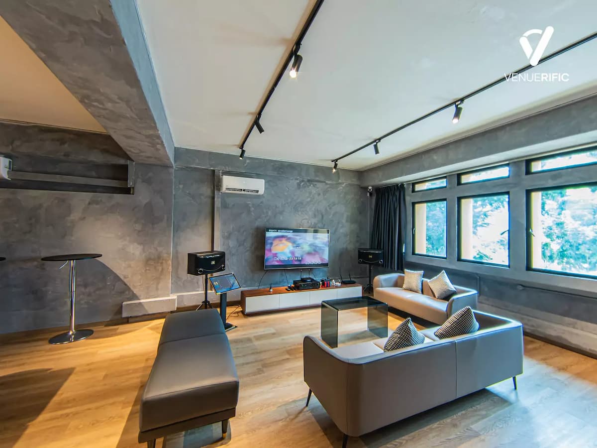 industrial event space with tv and karaoke area