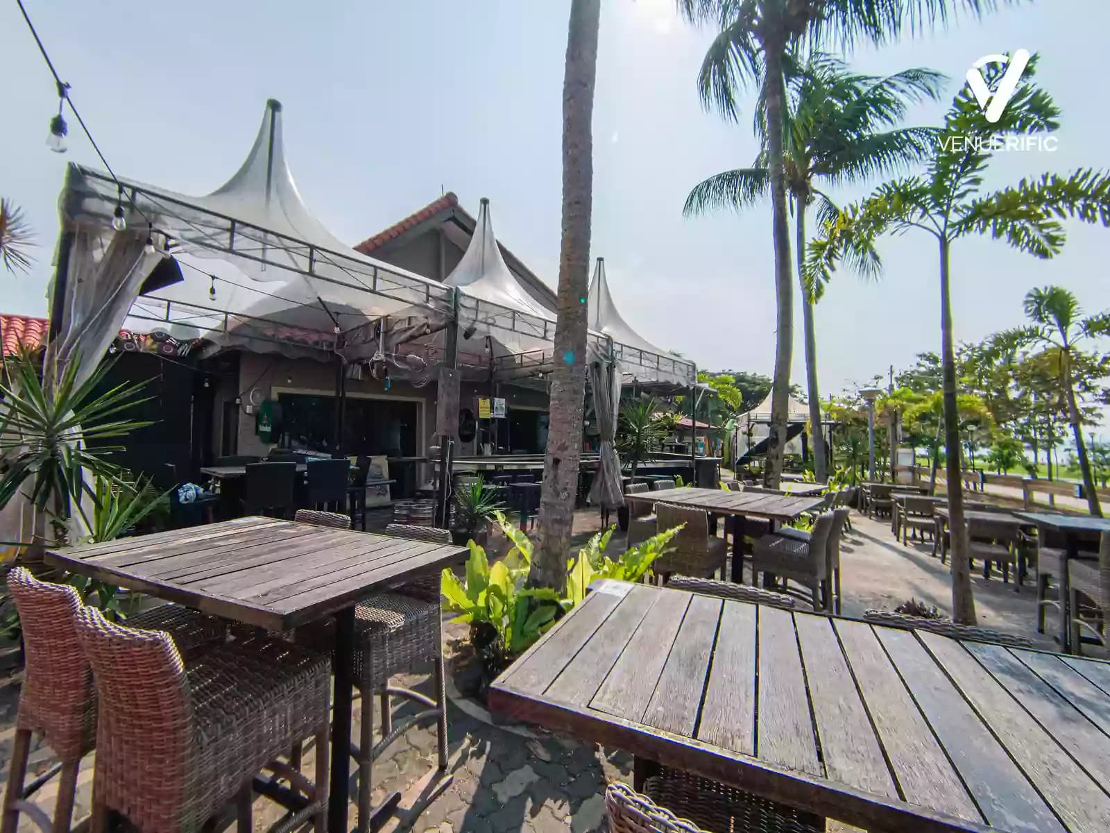 beach front restaurant with tables and chairs
