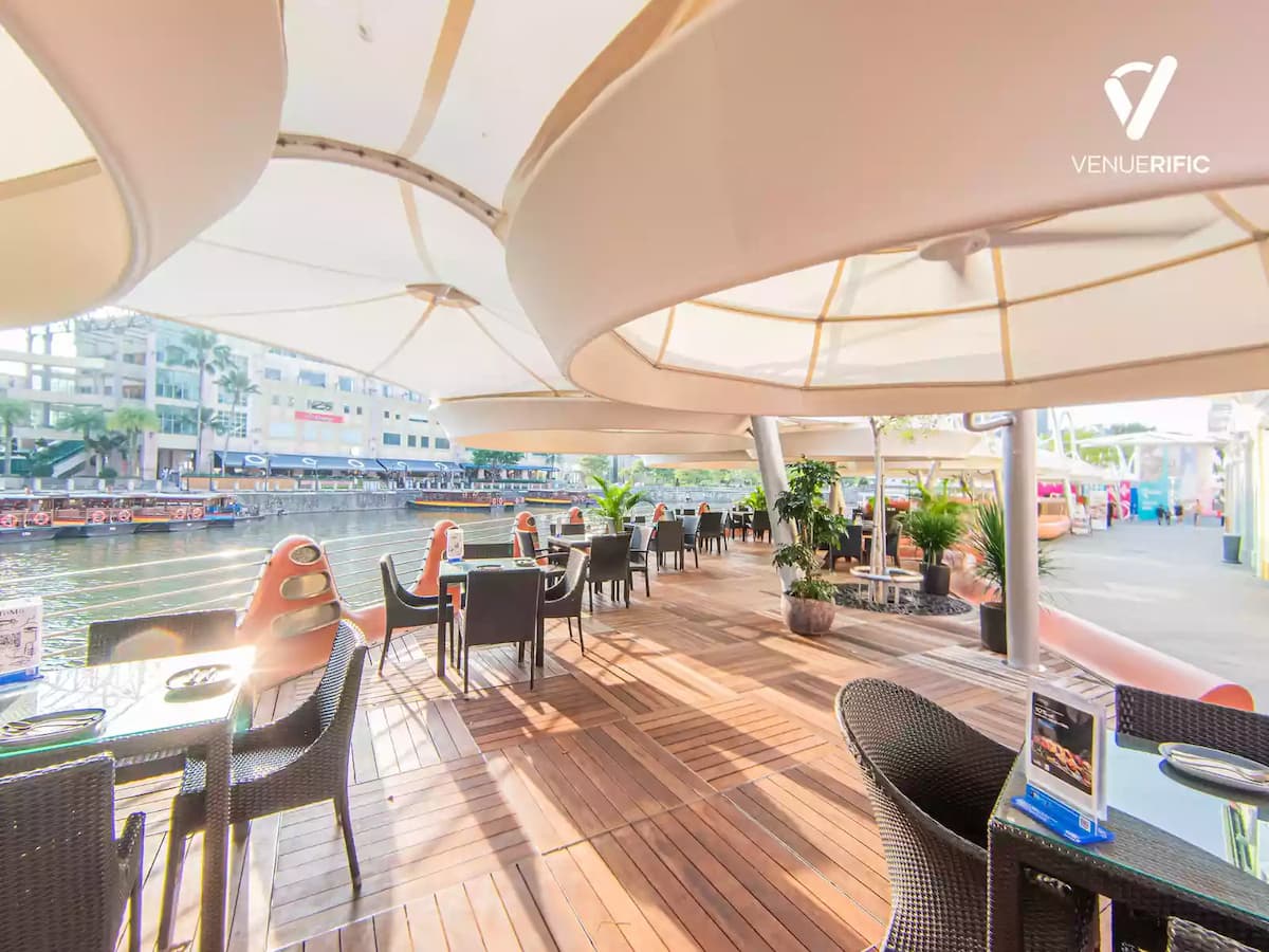 dining area in front of a river with sunlight