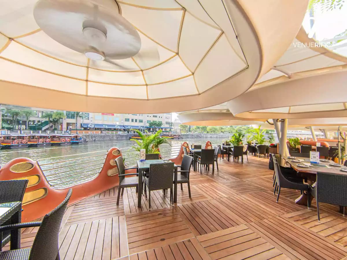 dining area in front of river with cruise options