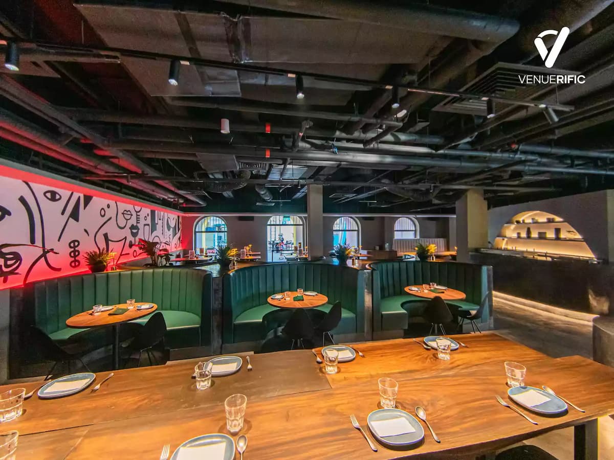 booths for dining and long wooden tables for dining
