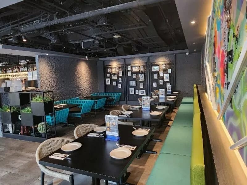 modern restaurant interior with tables chairs and couches