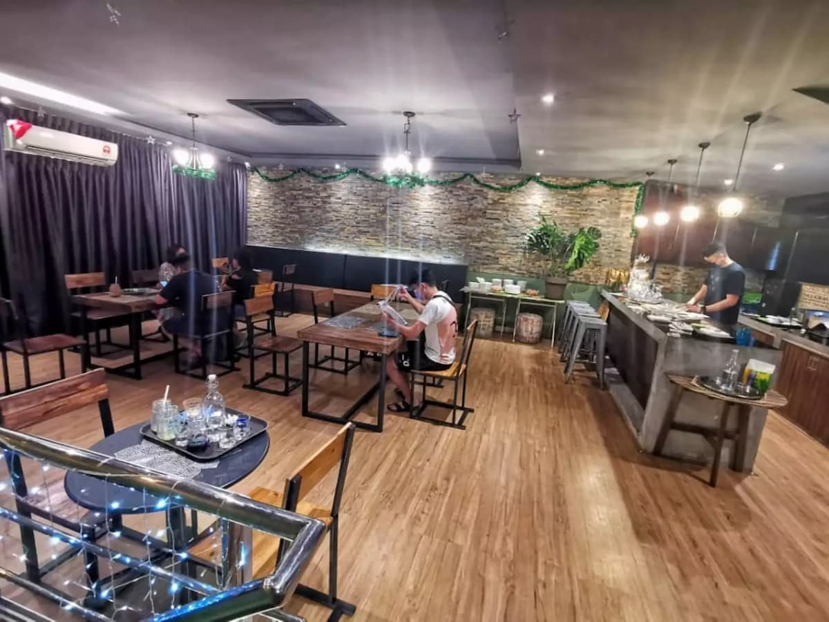 people dining while kitchen is being prepared in