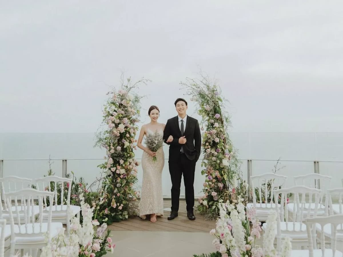 bride and groom taking pictures after making vow