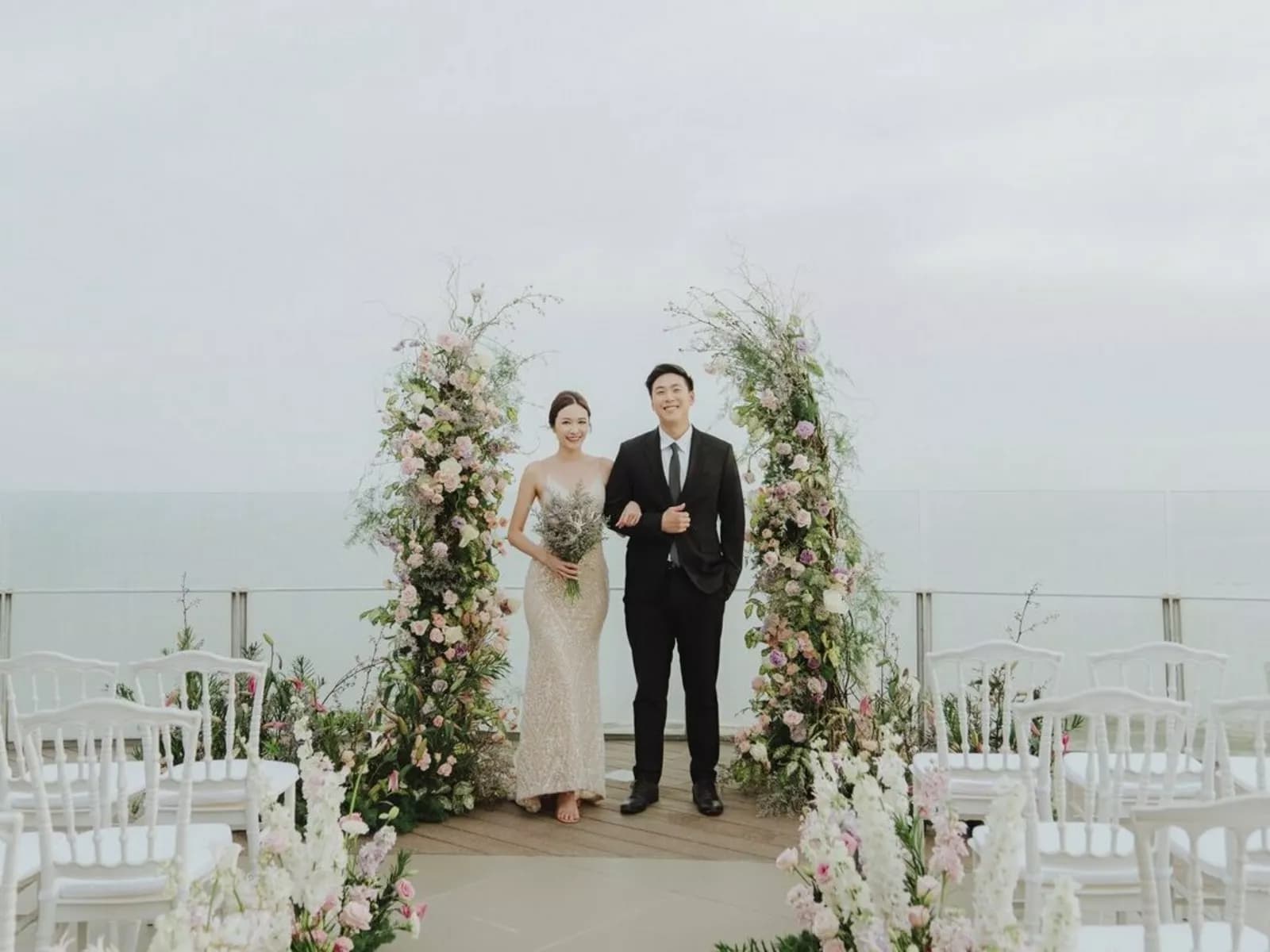 bride and groom taking pictures after making vow