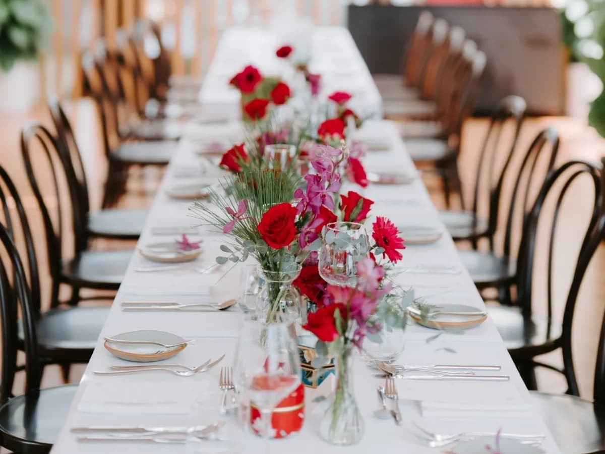 long table setup with rose flowers