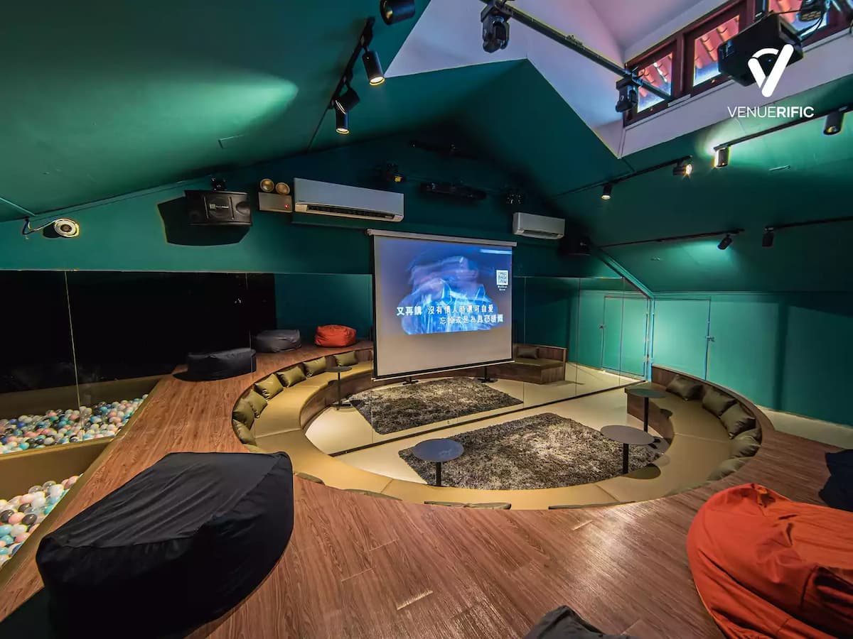event space area with circle sitting area and giant screen