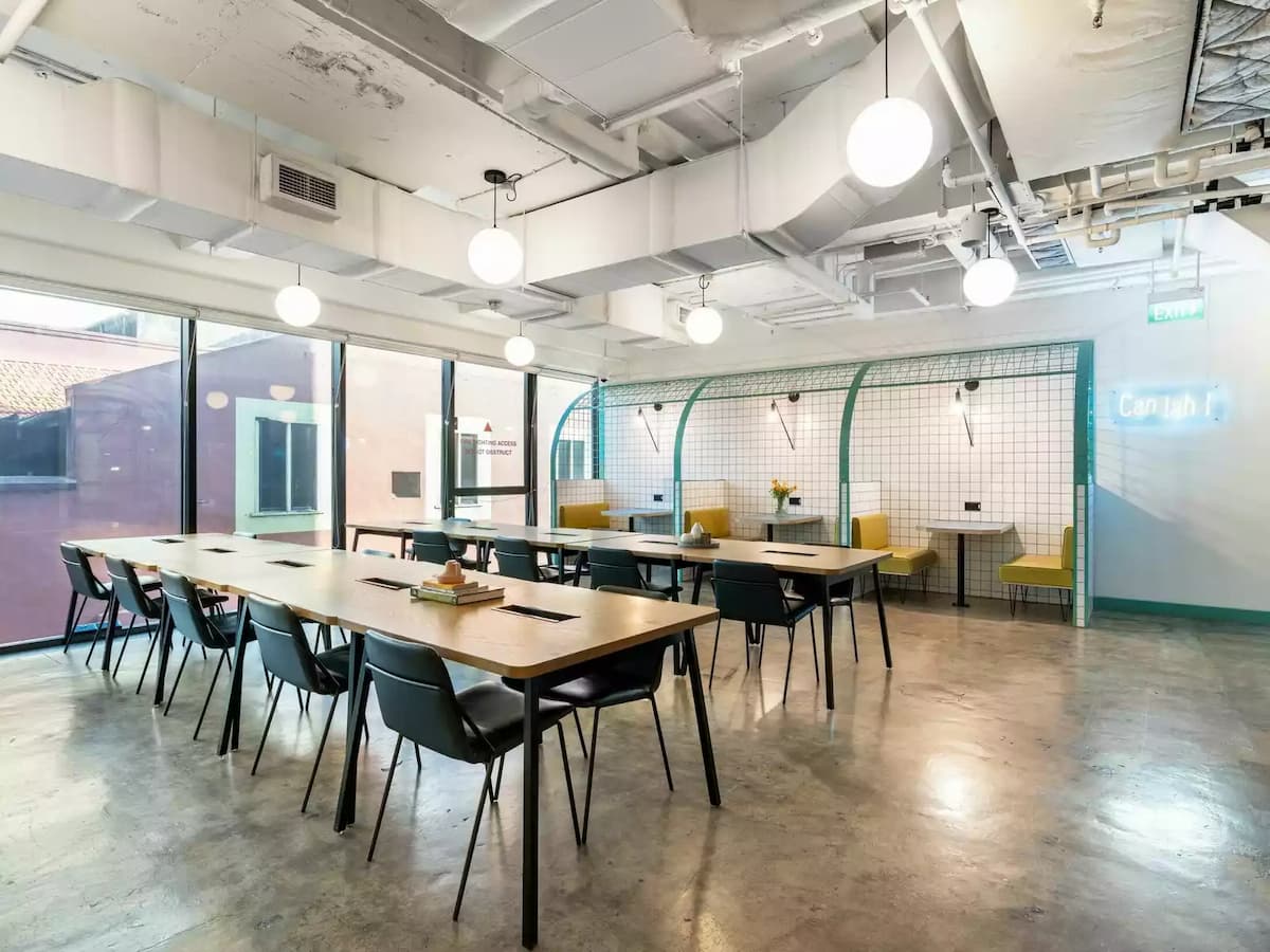 coworking area with private lounges, shared office desks