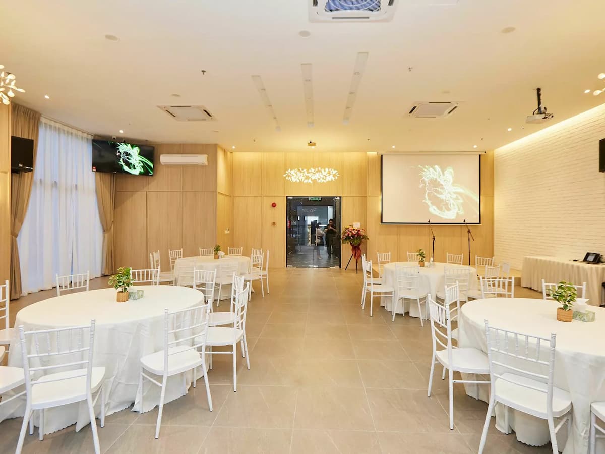 a wedding reception with white circle tables and chairs