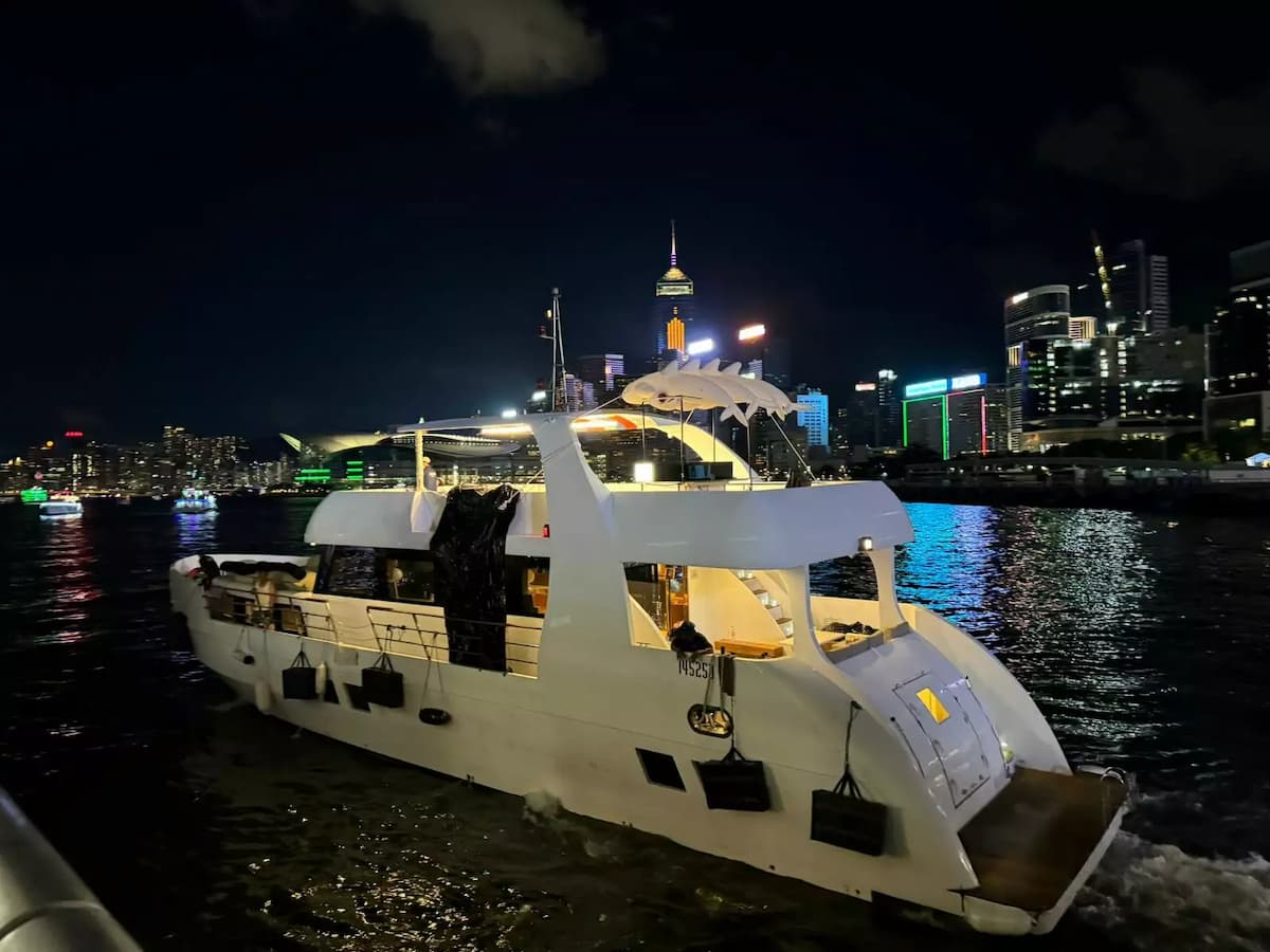 yacht sailing in the hong kong sea at night