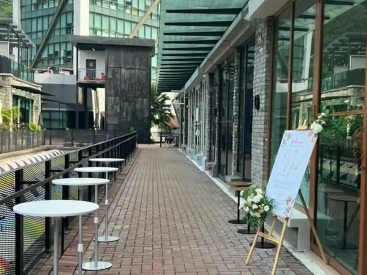 an outdoor table set up in a hall way