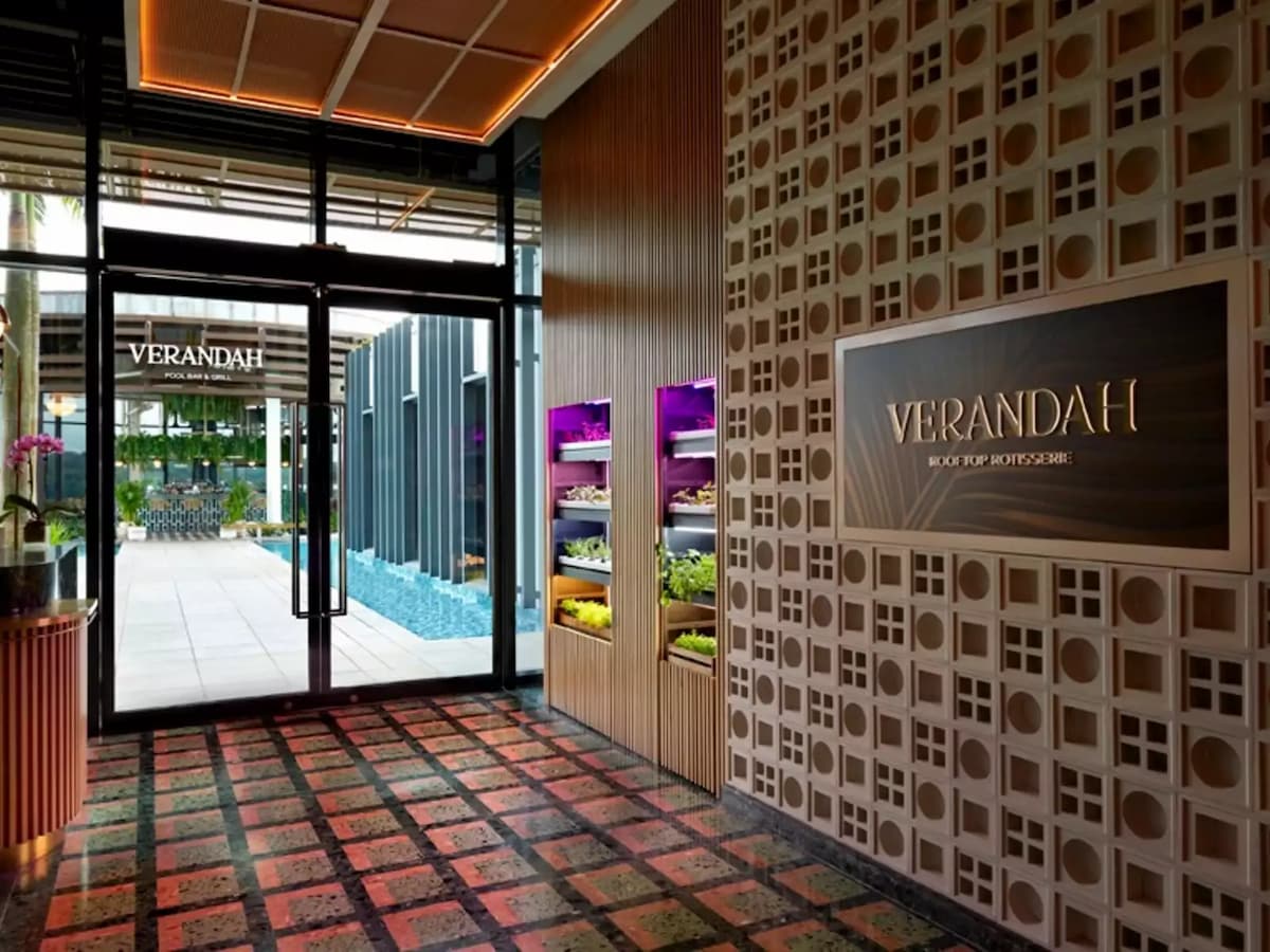 an entrance of a rooftop bar and grill