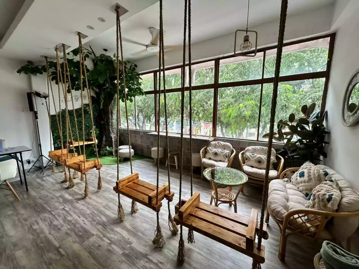 a room with wooden swing and bohemian vibe