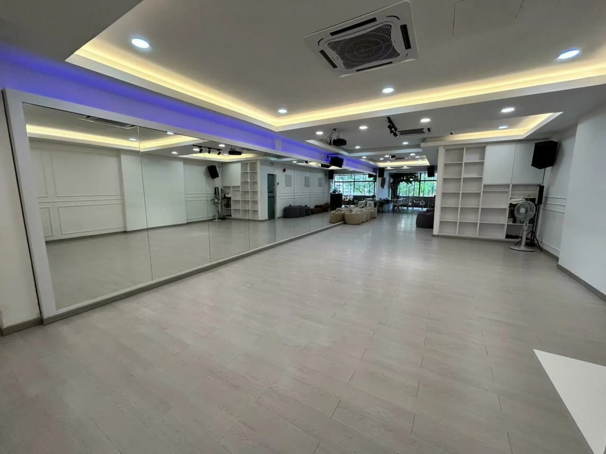 a wide room with full length wide mirrors